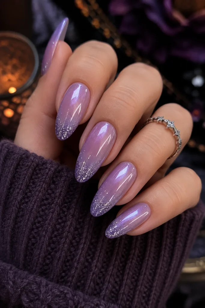 Glazed lilac nails with a soft pearly shine and silver star dust
