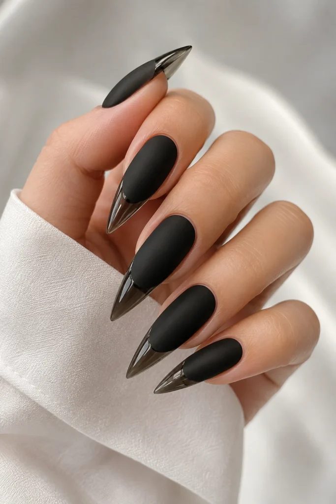 Matte black stiletto nails with glossy pointed tips