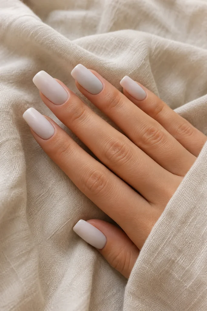 Matte milky white coffin nails with a soft velvety finish
