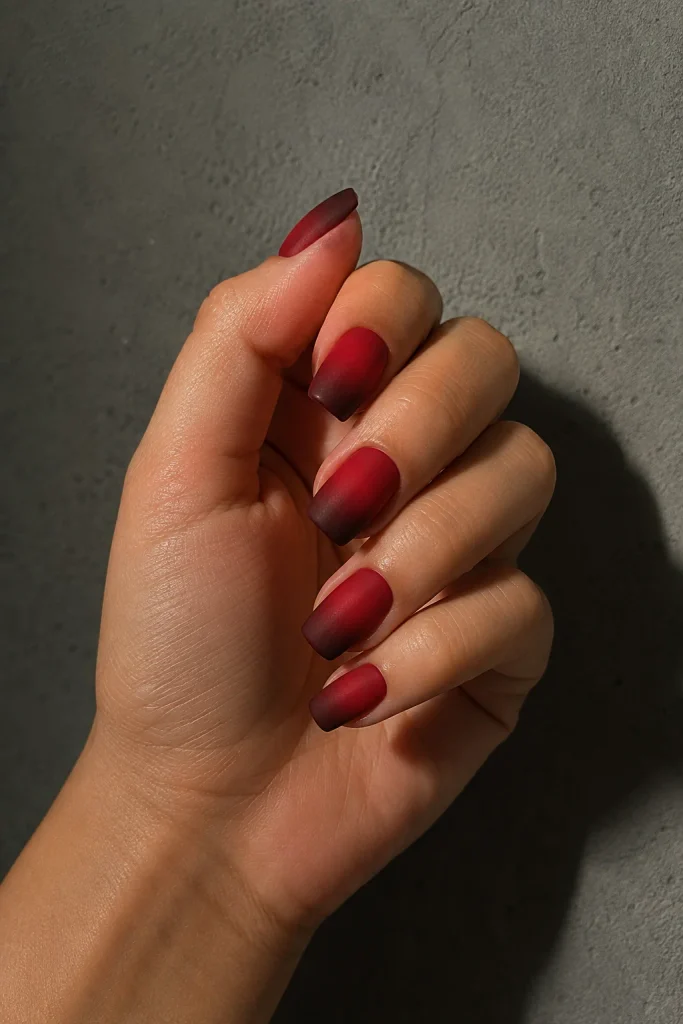 Matte red ombre nails with a modern finish