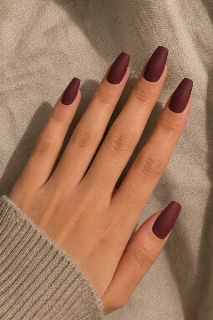 Matte wine red coffin nails with a soft velvet finish
