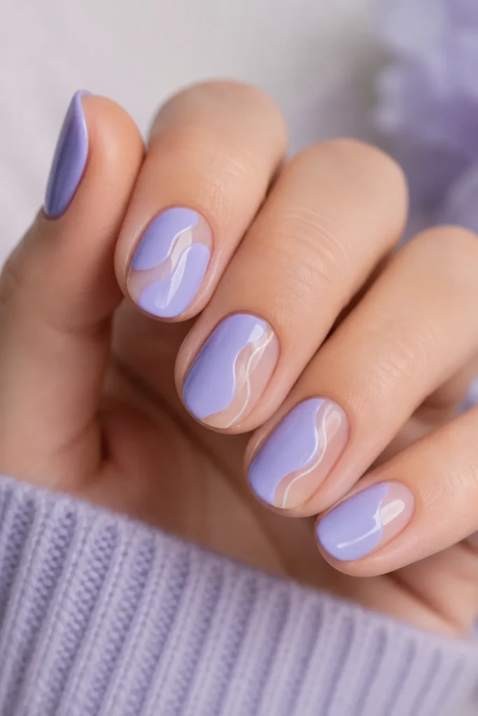 Round nails in periwinkle matte polish with negative space design