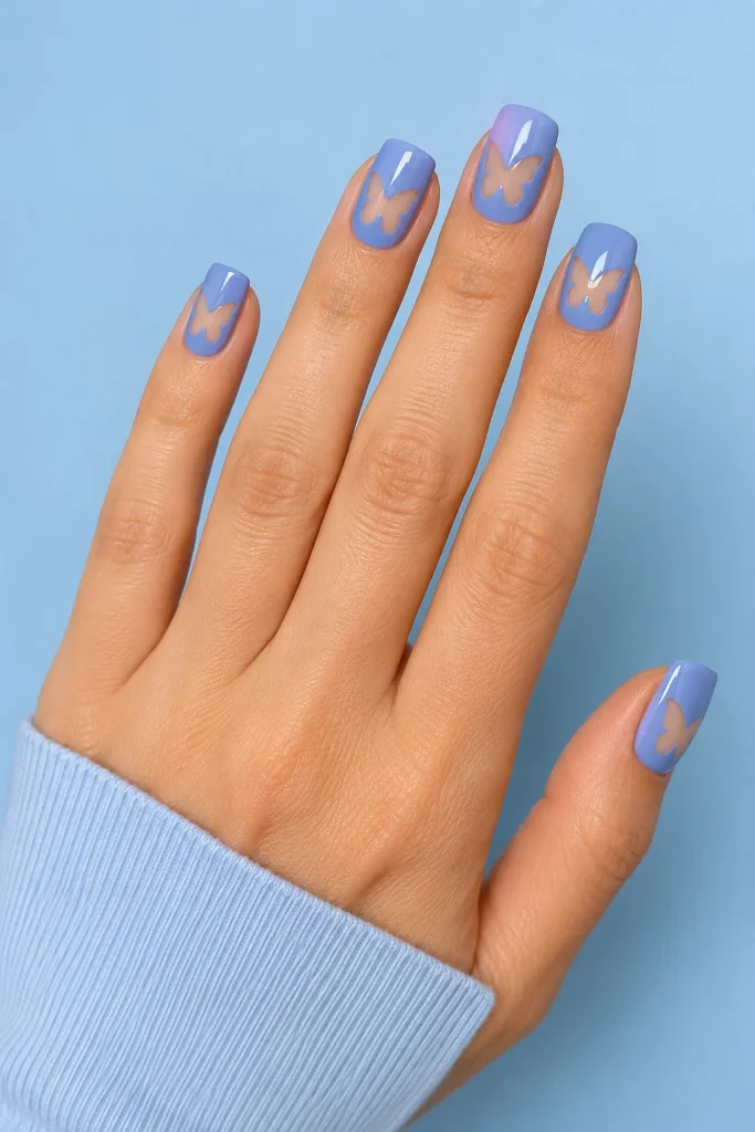 Periwinkle nails with negative space butterfly cutouts