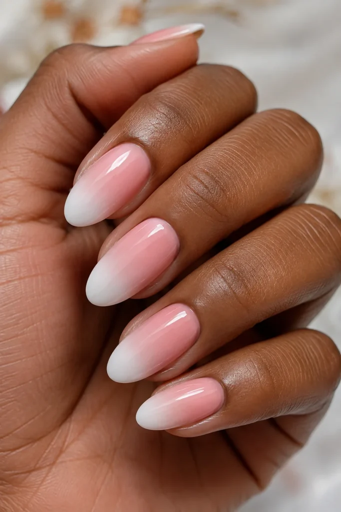 Pink to white ombre fade nails on almond shaped nails