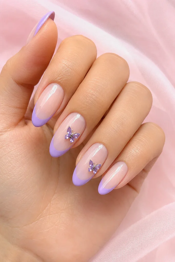 Pastel purple French tips with butterfly charms