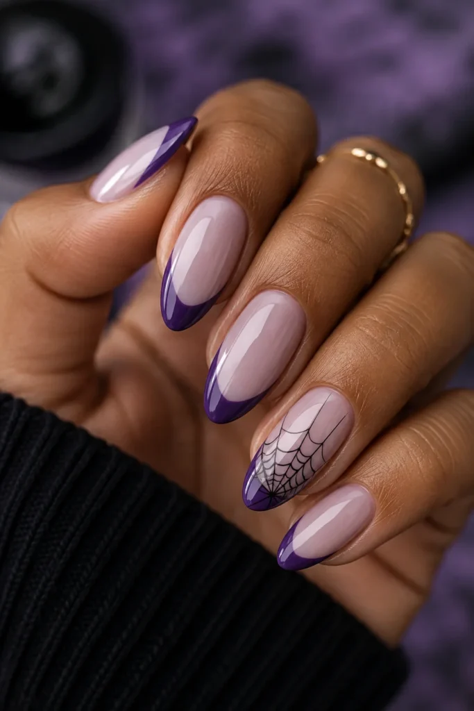 Purple French tip nails with a fine black cobweb line design