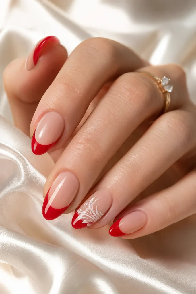 Red French tips with a white swirl accent