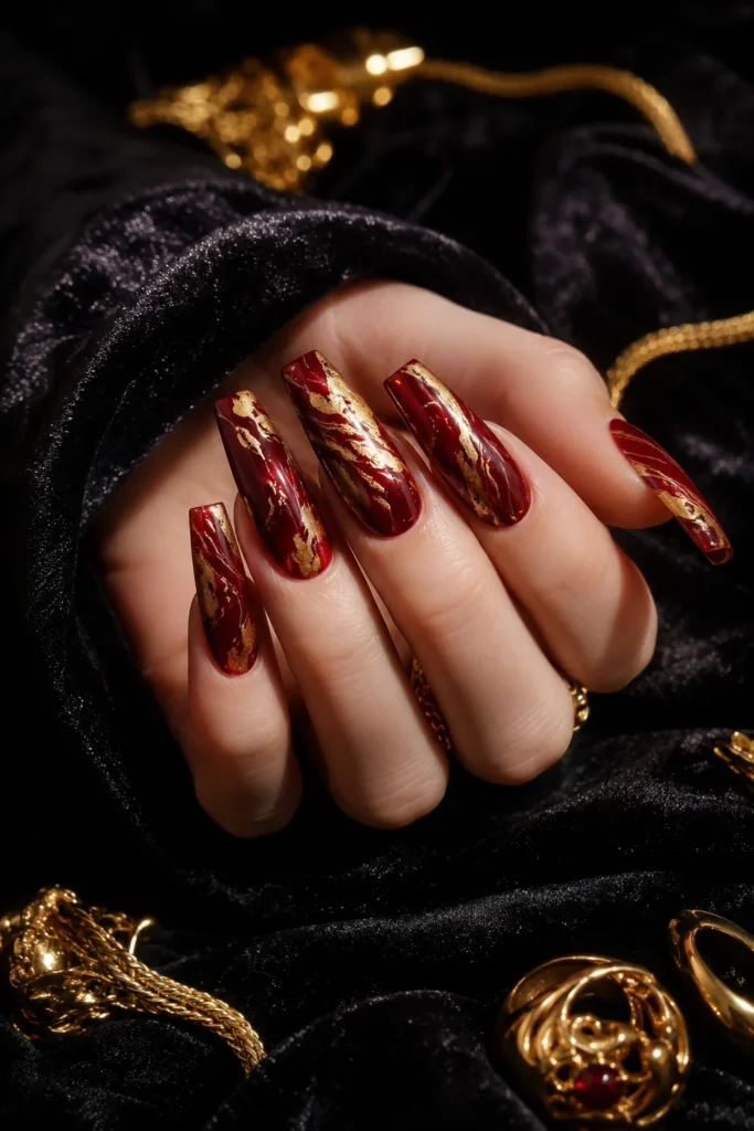 Red and gold marble wedding nails with luxury stone-inspired design