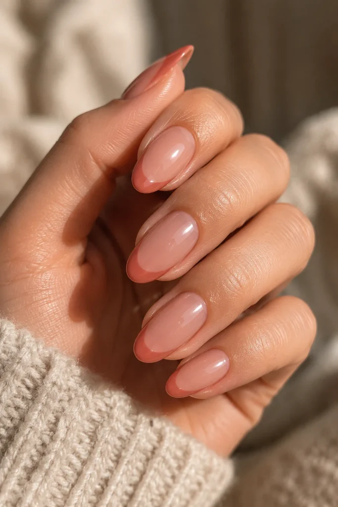 Terracotta pink French tip nails for a warm fall look