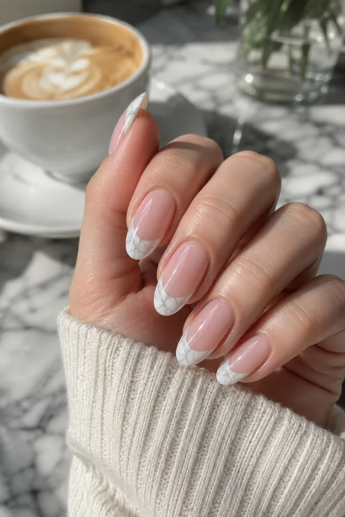 White marble French tip nails on sheer base