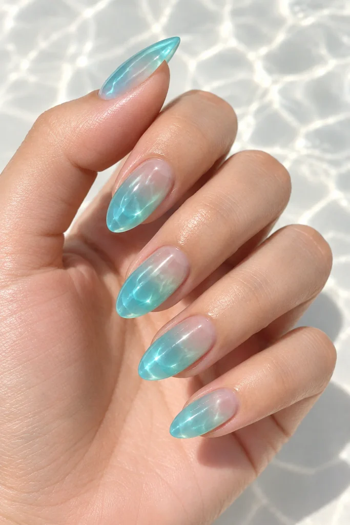 Aqua jelly almond nails with glossy translucent finish