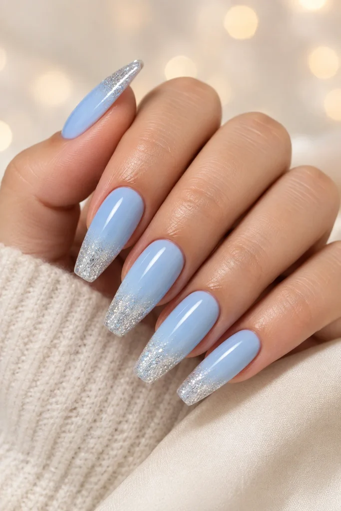 Baby blue nails with sparkling silver glitter tips