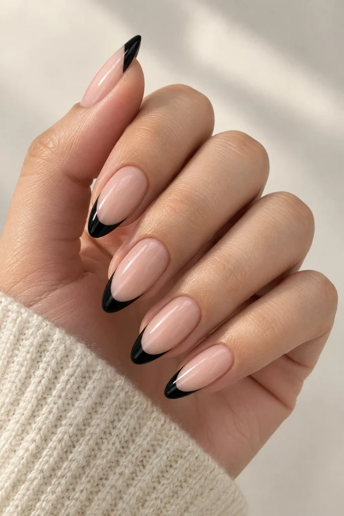 Black almond nails with modern French tips