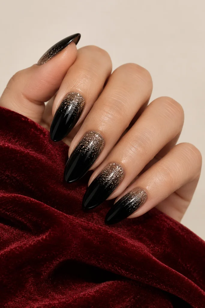 Black almond nails with subtle glitter ombre