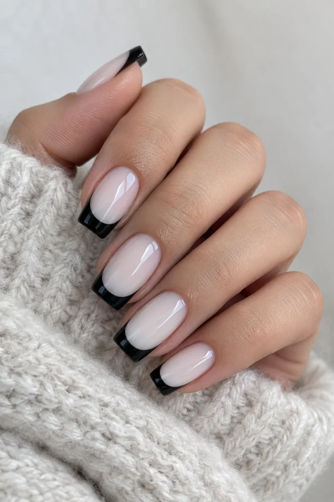 Black French tips over a milky white square base