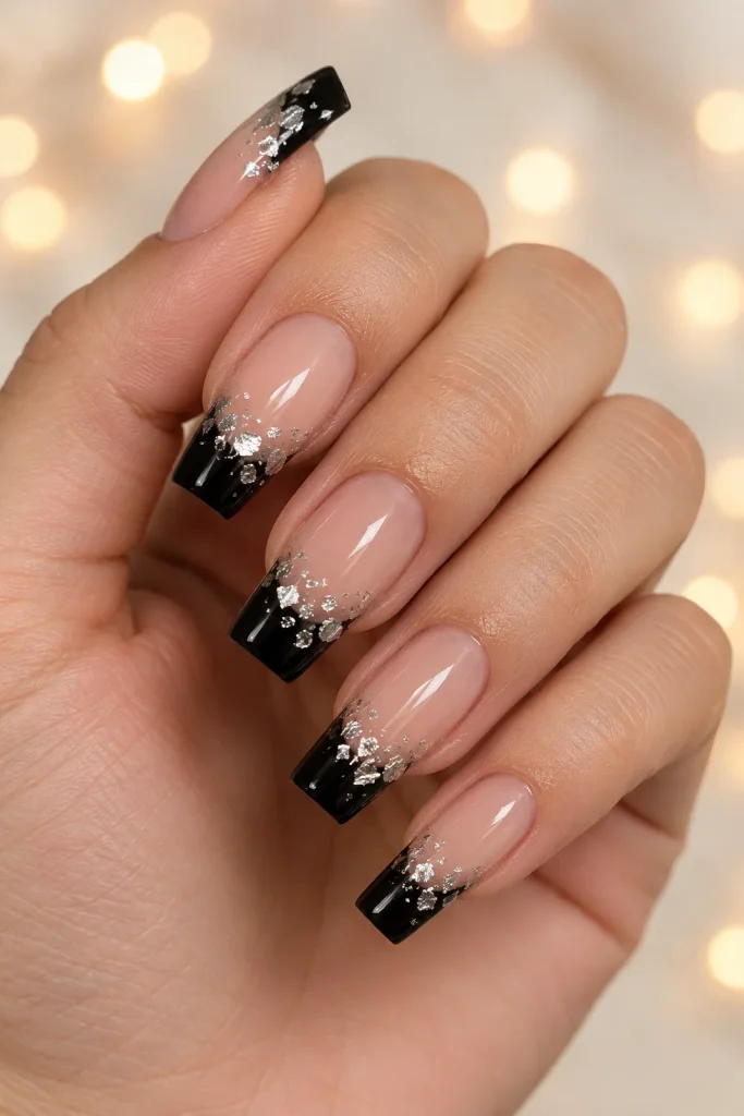 Black French tips with silver foil details on square nails