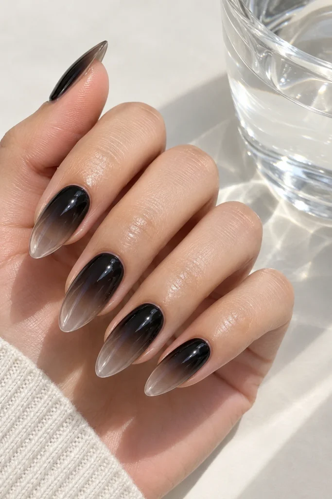 Black glazed glass ombre almond nail design