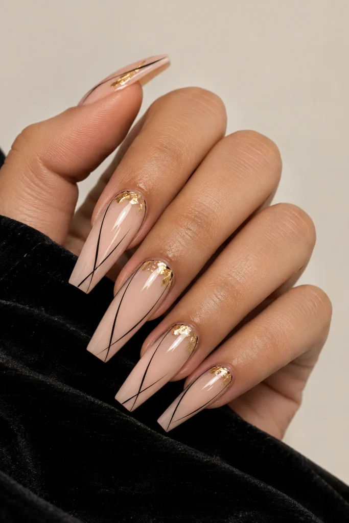 Black line nails with elegant gold accents
