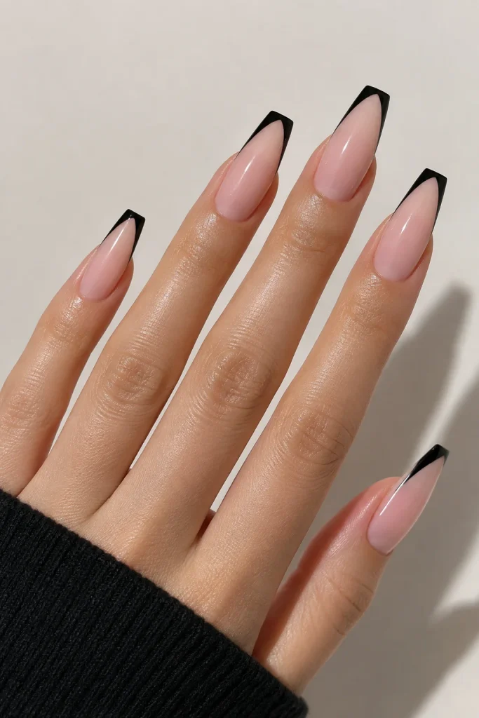 Sheer nude coffin nails finished with thin black tips