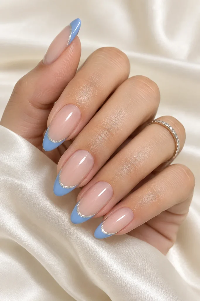 Blue French tip nails with thin silver lining