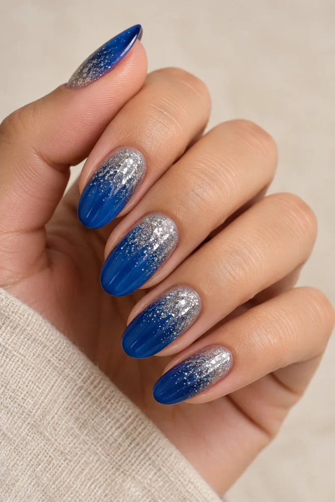 Blue nails with a silver glitter gradient
