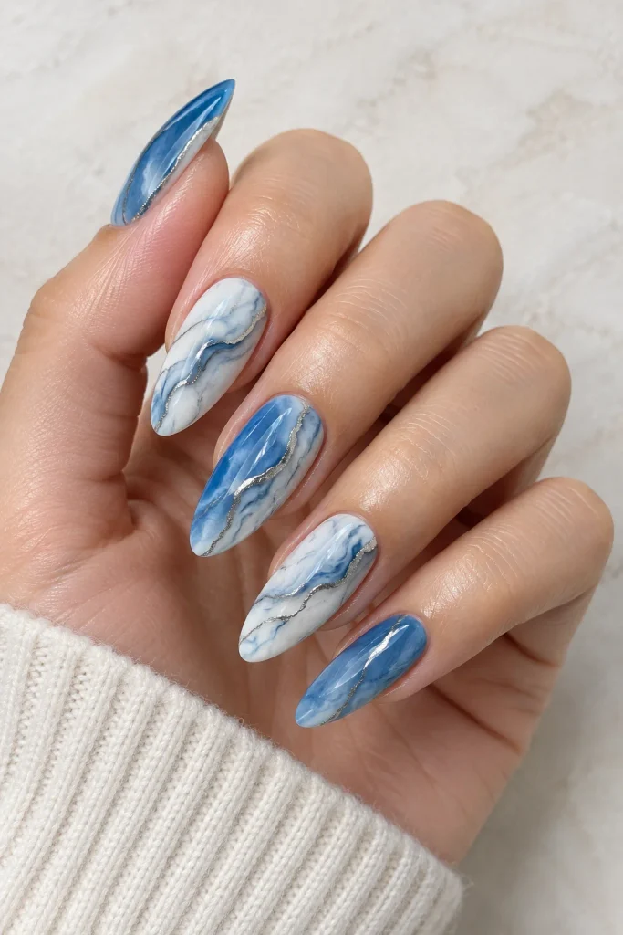 Blue marble nails with delicate silver veining