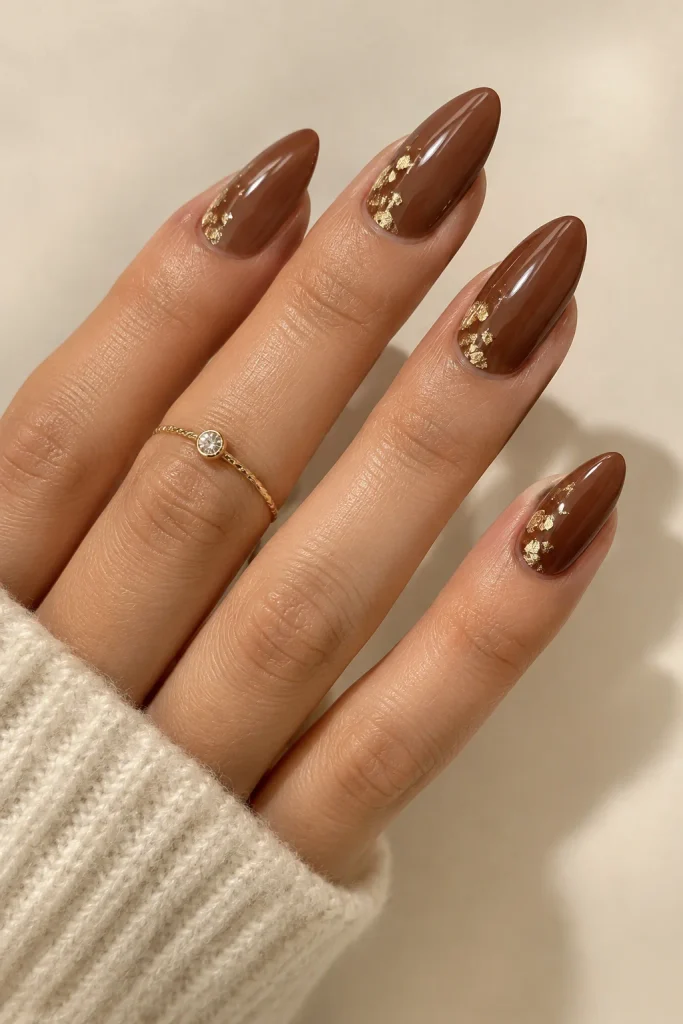 Brown nails with delicate gold leaf detailing