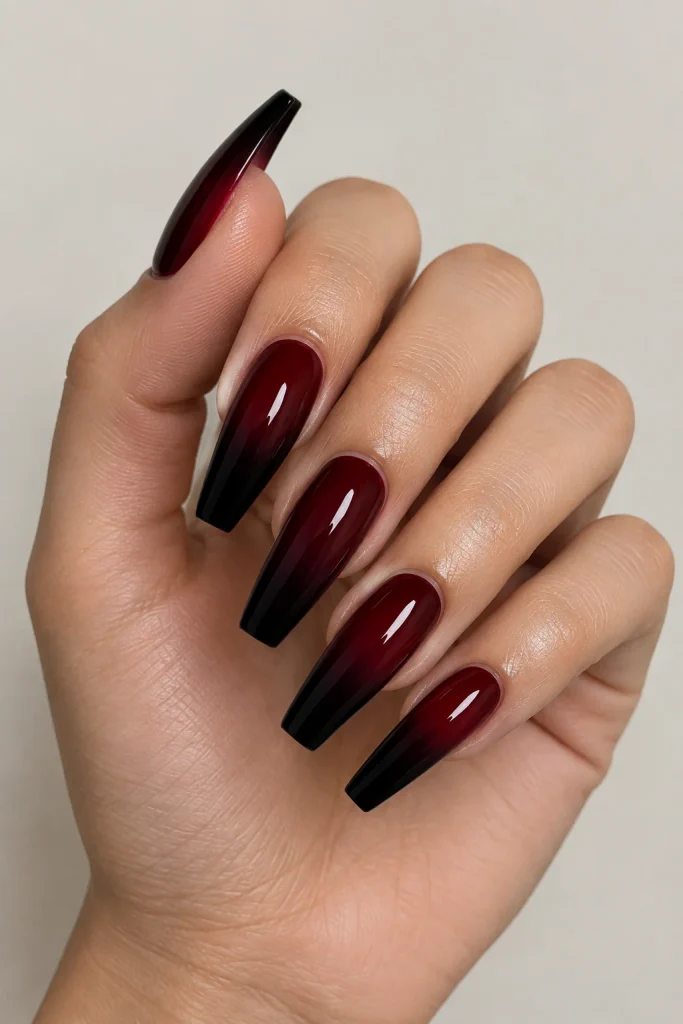 Deep burgundy fading into black ombre nails
