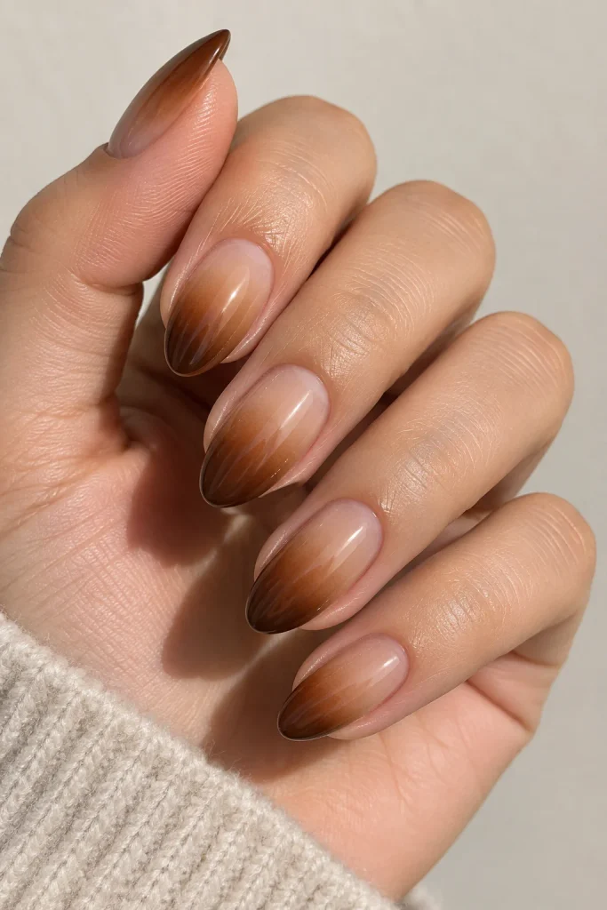 Short nails featuring smooth caramel brown ombre design
