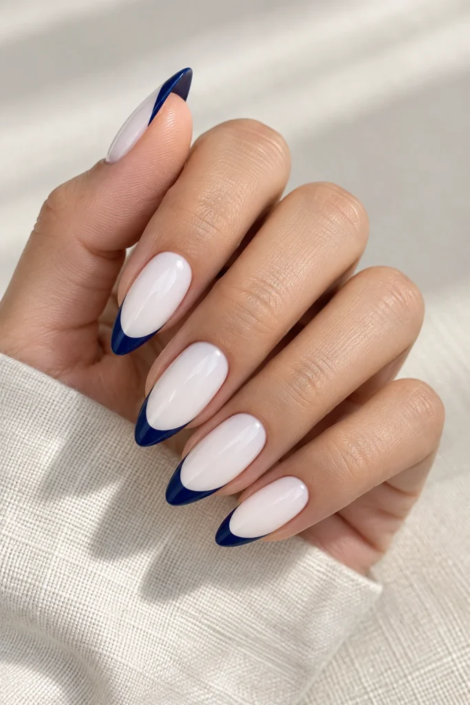 Classic blue and white French tip nails on almond shape