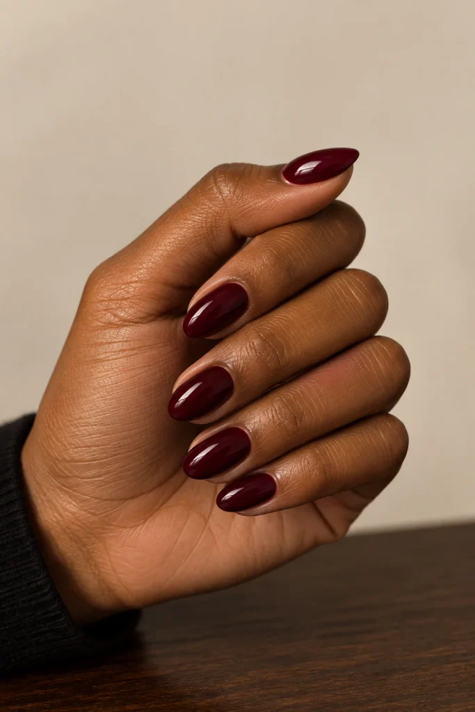 Classic burgundy nails for darker skin tones