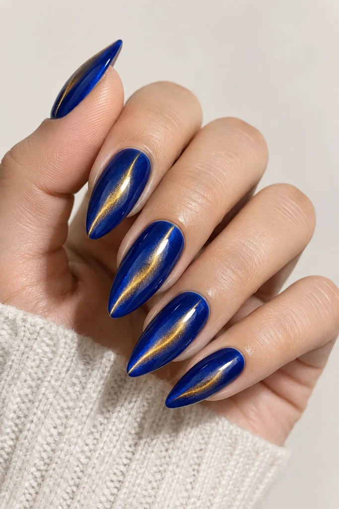 Cobalt blue nails with gold chrome cat eye