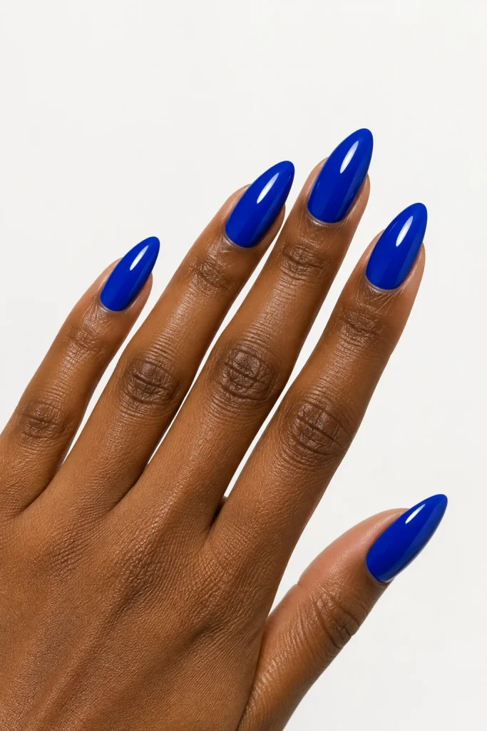 Bold cobalt blue nails for darker skin tones