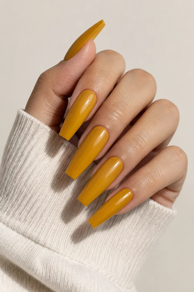 Deep amber yellow coffin nails with glossy finish