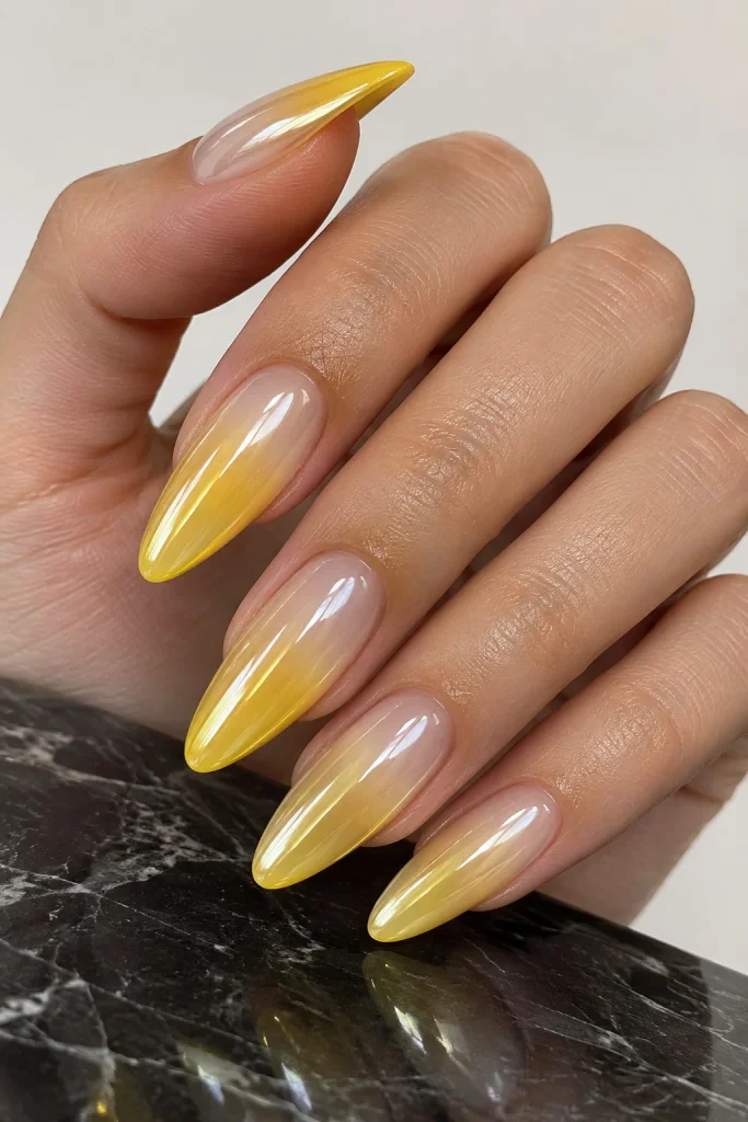 Glazed yellow chrome ombre nails with glassy shine