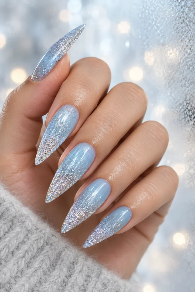 Icy blue nails with silver glitter ombre design