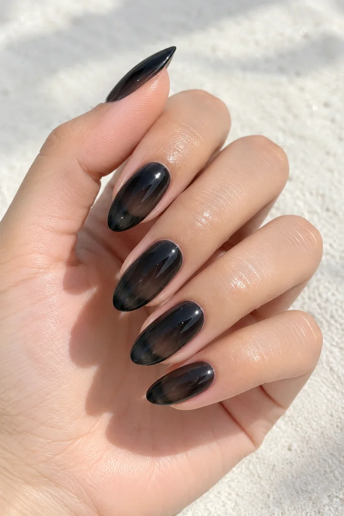 Sheer jelly black almond nails glossy finish