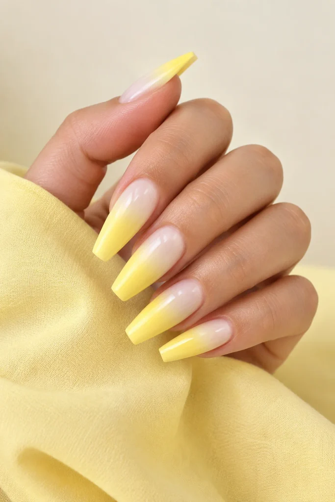 Lemon yellow ombre nails fading from white