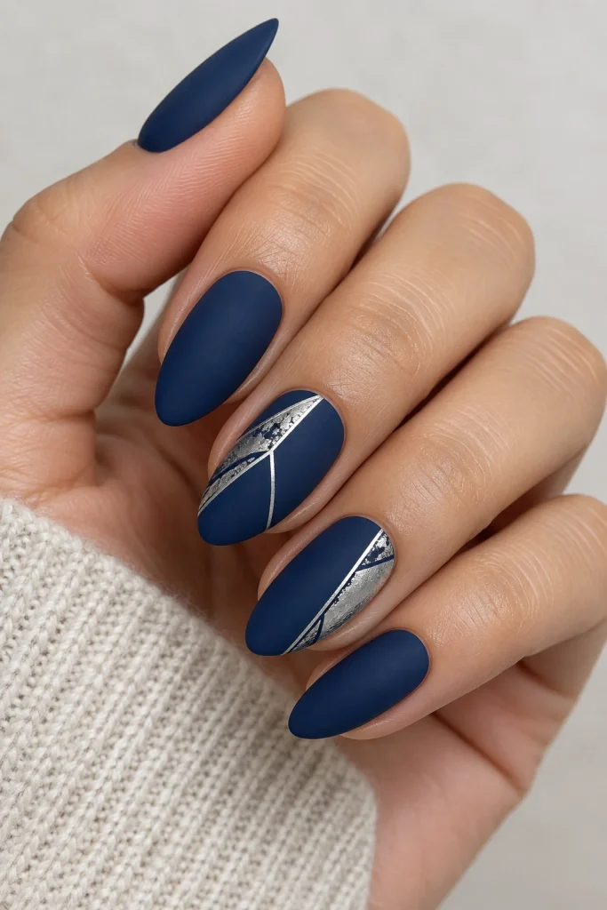 Matte navy nails with silver foil accents