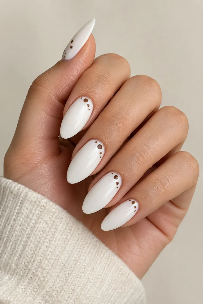 Minimal brown dots on white almond tip nails