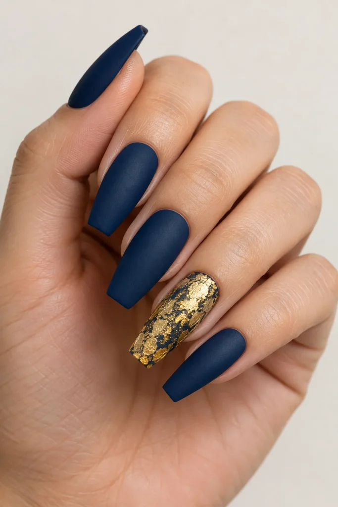 Matte navy nails with gold leaf accent nail