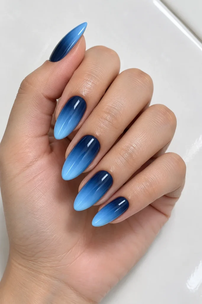 Navy to sky blue ombre almond nails