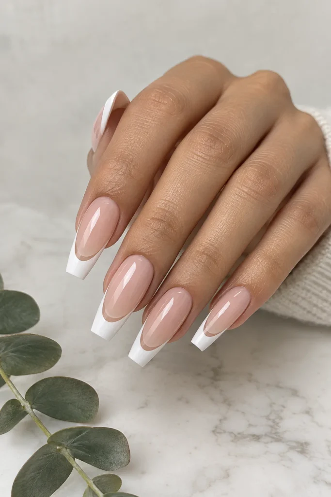 Coffin manicure showing natural nail between French tip lines