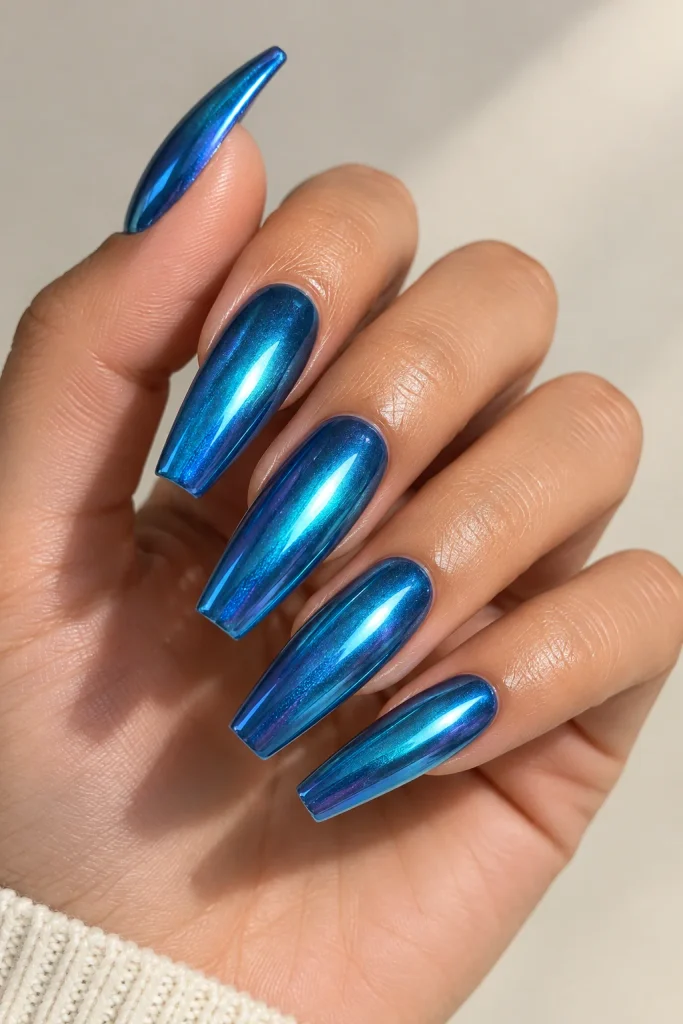 Shiny ocean blue chrome coffin nails with reflective finish