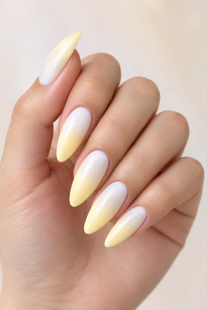 Pastel yellow nails with smooth ombre fade