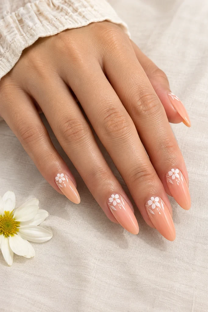 Peach nails with delicate floral line art
