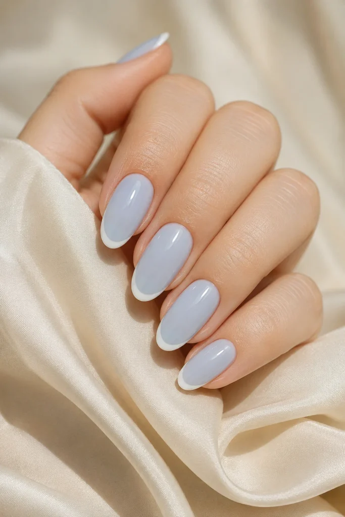 Powder blue milky nails with delicate white tips