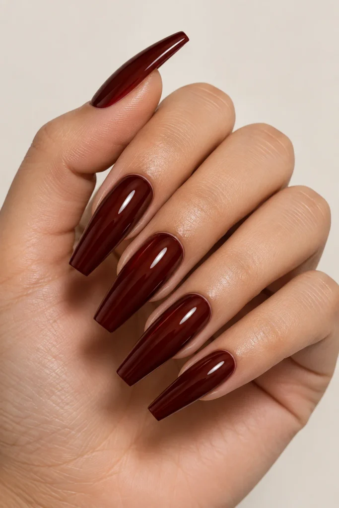 Rich mahogany red-brown nails with glossy finish