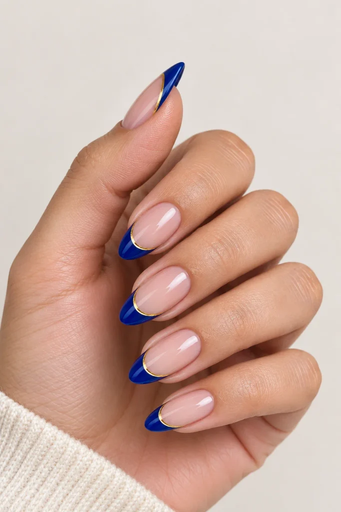 Royal blue French tips with thin gold lining