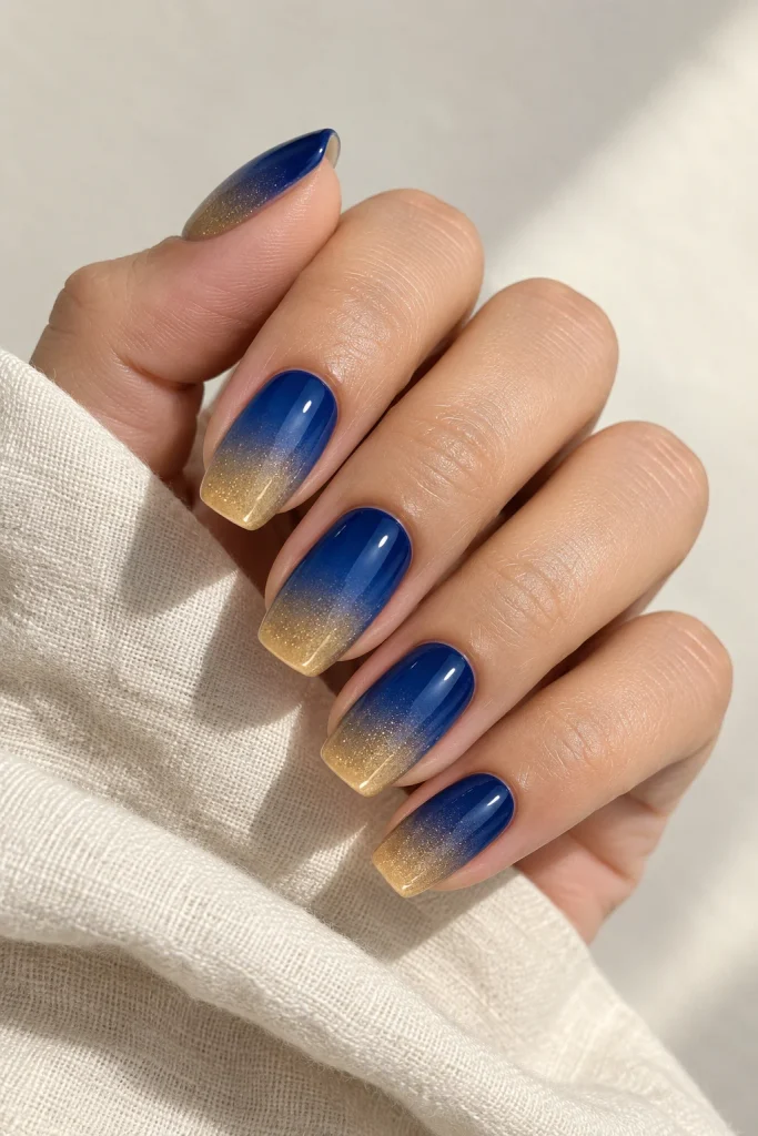 Sapphire blue ombre nails with gold tips